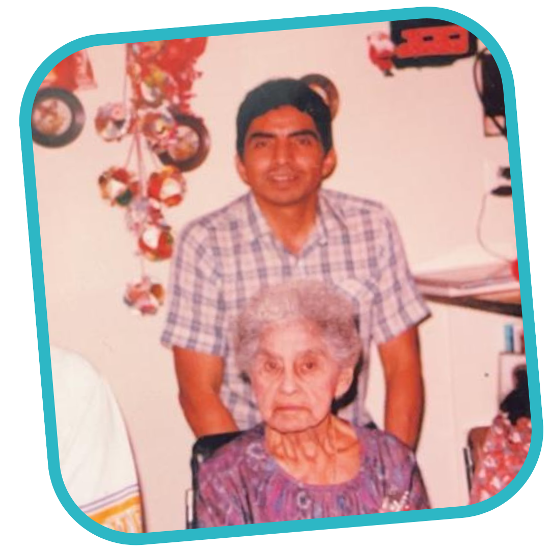 This is a picture of Ravena Soto’s father standing behind her seated grandmother at their home in Los Angeles. 